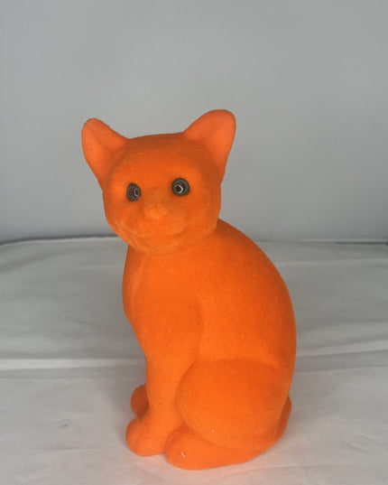 Sitting Flocked Green-Eyed Bright Orange Cat