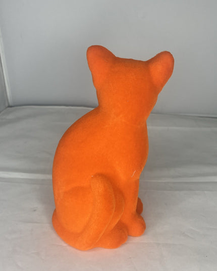 Sitting Flocked Green-Eyed Bright Orange Cat